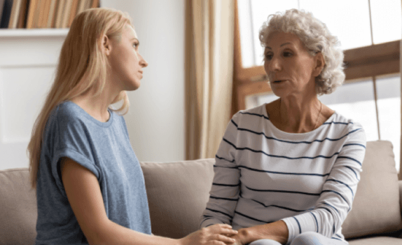 Young woman and senior woman talking